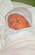 newborn with cap