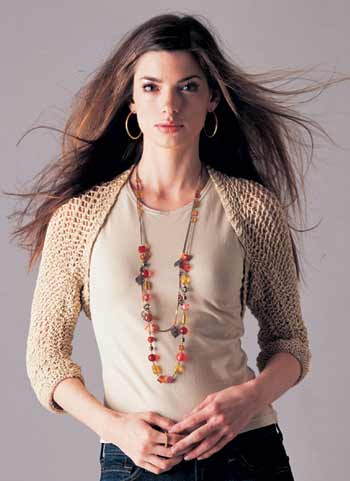model wearing gold knit shrug