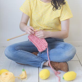 Girl with knitted blanket